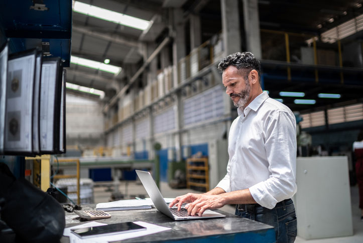 using laptop in warehouse