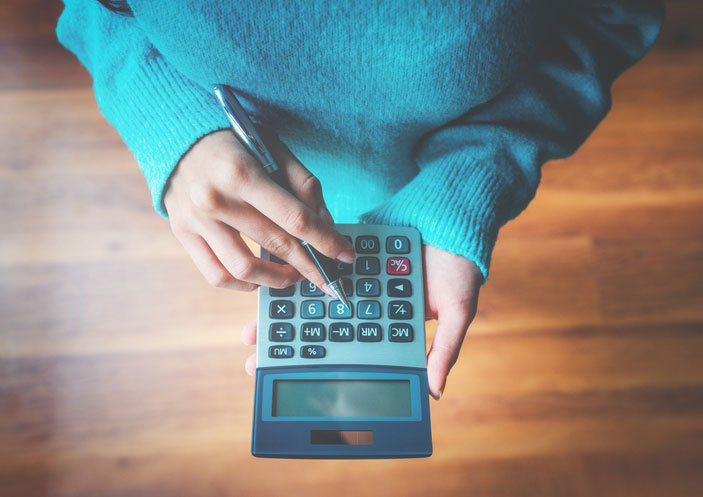 woman using a calculator