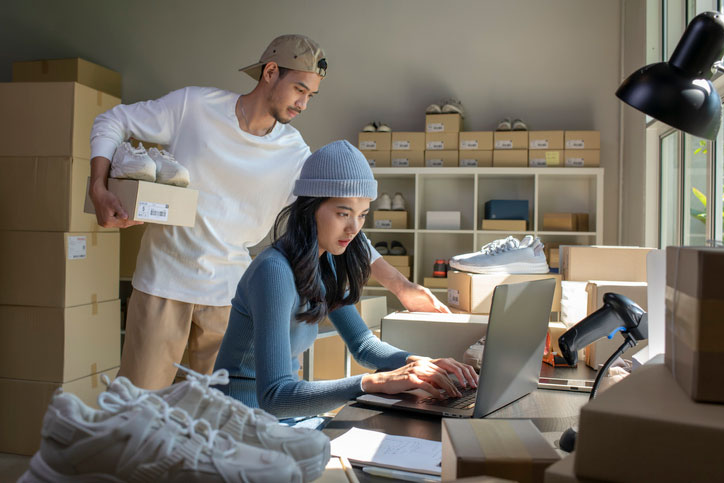 couple packing boxes from home