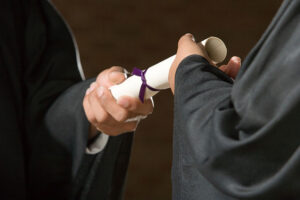 receiving diploma at graduation