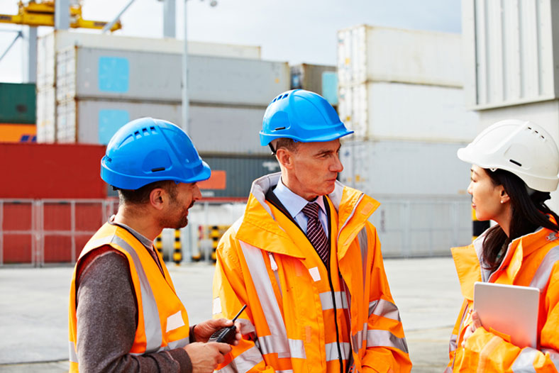 group of workers outside at the port