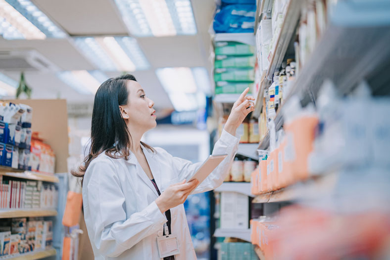 pharmacist checking inventory