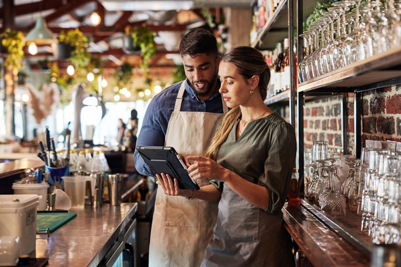 restaurant staff using tablet