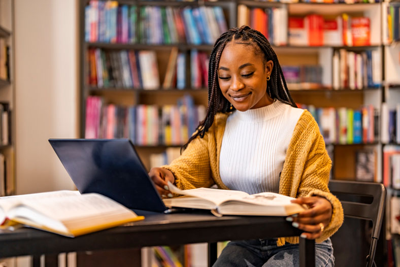 student in library