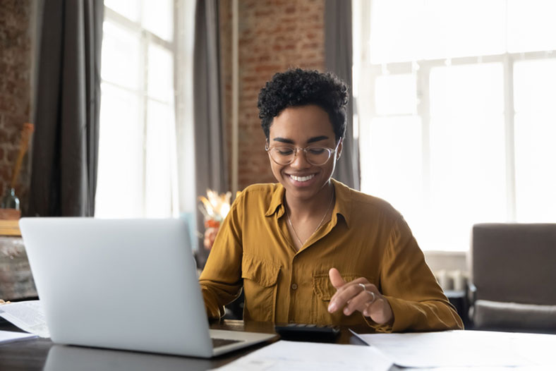 female working on computer at home